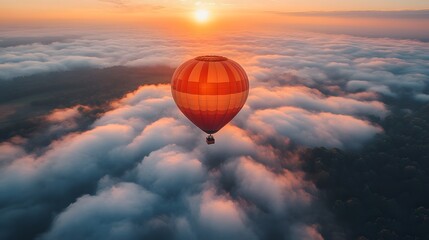 Obraz premium Hot Air Balloon Above Clouds During a Stunning Sunrise and nature themes.