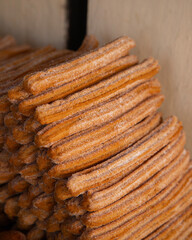 Market stall in Oaxaca with traditional sweets such as churros, donuts and meringues.