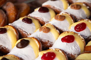 Market stall in Oaxaca with traditional sweets such as churros, donuts and meringues.