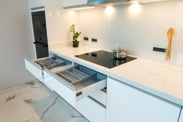 Modern Kitchen with Open Drawers, Sleek Countertop, and Minimalist Design Elements for Contemporary Spaces