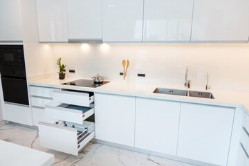 Modern minimalist kitchen design with white cabinetry and stylish appliances for contemporary living