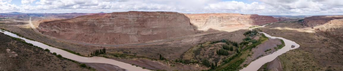 Panoramic aerial view of big cliff sandstone formations by the river. Chubut province, Argentina