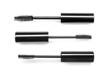 Different mascara brushes on white background, set