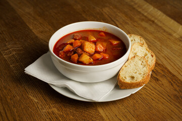Bowl of hearty stew with bread slices