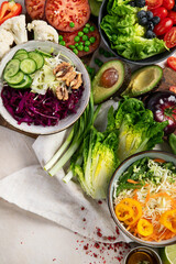 Table full with organic vegetables for making salad.