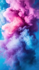 Fototapeta premium Ethereal cloud of vibrant pink and blue smoke mixing in a dynamic swirl against a soft background creating a dreamy and abstract artwork