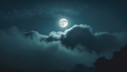 Midnight moonlight illuminating clouds in a hazy sky