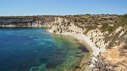 Fototapeta premium Tourism thrives along sunny Malta coast, tourism showcasing clear waters and rugged cliffs, tourism beckoning global explorers to discover vibrant cultural heritage