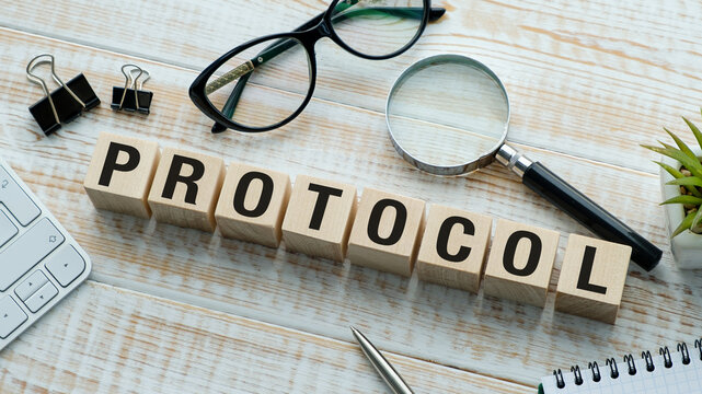 A wooden block with the word protocol written on it