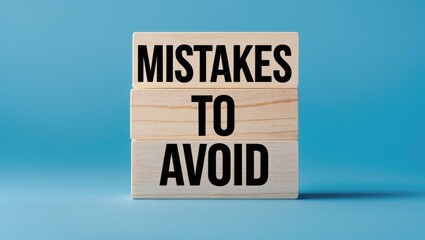 Message on blocks stating mistakes to avoid with a background. Symbol of conceptual mistakes to avoid. Space for copying.