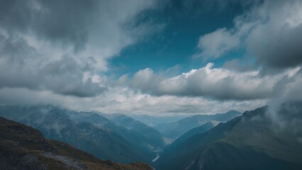 Obraz premium A stunning mountainous landscape is depicted vertically against a cloudy blue sky.