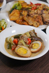 Traditional Indonesian dish, captured on March 12, 2025. A flavorful combination of rich spices and fresh ingredients, showcasing Indonesia’s authentic culinary heritage