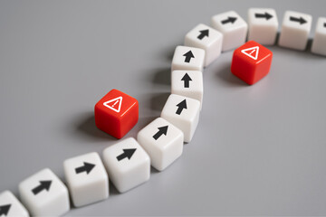 arrow avoid risk warning sign on red cube with copy space. Risk management concept with preventive plan for any accident or unplan incident to protect business or system from failure or crisis.