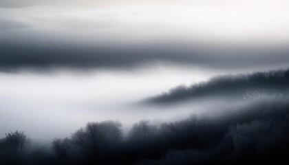 Obraz premium Soft white fog envelops a serene landscape at dawn, creating an ethereal atmosphere over the distant hills