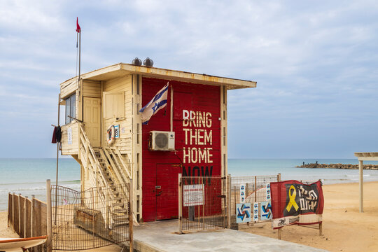 Haifa, Israel &ndash; November 26, 2025, A red-painted lifeguard booth with the inscription "bring them home" and a yellow ribbon, a symbol of hostages.