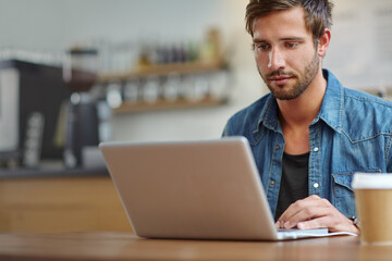 Business, man and typing with laptop in cafe for online article, story research and creative...