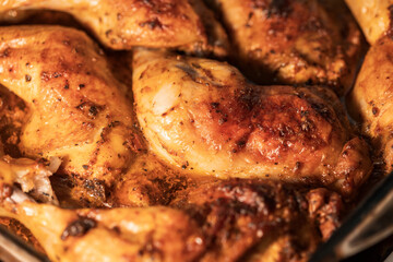A close up of a pan of chicken with a lot of seasoning on it