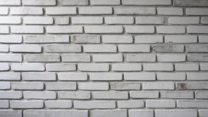 Fototapeta premium Abstract weathered texture of aged stucco in light gray and old paint on a white brick wall background in a rural setting, featuring grungy rusty stone blocks, suitable for technology color horizon...