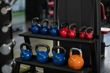 A pair of dumbbells neatly arranged in the gym, ready for a powerful workout session to build strength and endurance