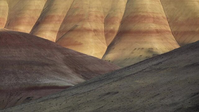 Colorful layers of sediment create a stunning view at John Day Fossil Beds National Monument in Painted Hills, Oregon