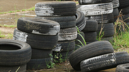 Landfill with old tires and tyres for recycling. Reuse of the waste rubber tyres. Disposal of waste...