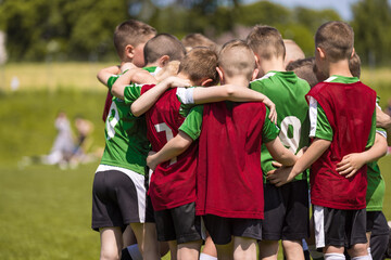 Boys Play Sports. Children's Sports Team United in a Circle Ready to Play Game. Children's Team at Sports Field. Youth Sports For Children. Boys in Sports Uniforms. Young Boys in Soccer Sportswear