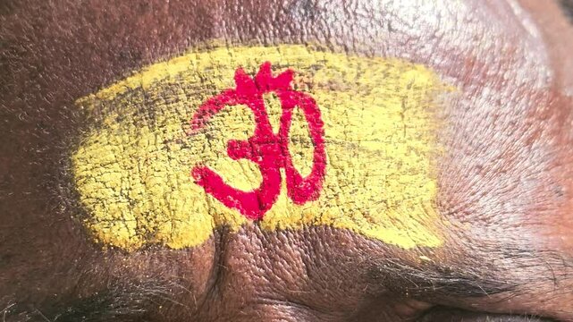 Omm tilak on forehead