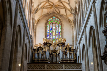 Obraz premium Large organ and large stained glass window in main hall in St Barbara Cathedral in Kutna Hora city in Czech Republic