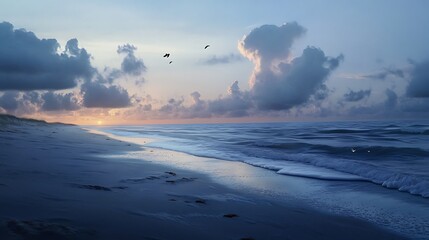 Fototapeta premium A serene beach scene at sunset, with gentle waves and clouds reflecting soft light.