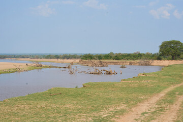 Slow flowing and wide Luangwa River as it flows through South Luangwa National Park, Zambia         