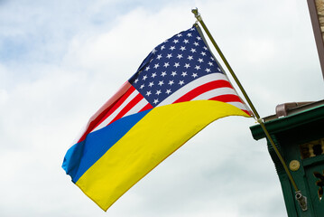 American Ukrainian flag against the sky