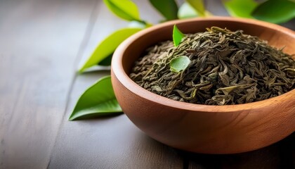 tea leaves in a bowl with natural textures and space for custom text ideal for tea related content and product promotion