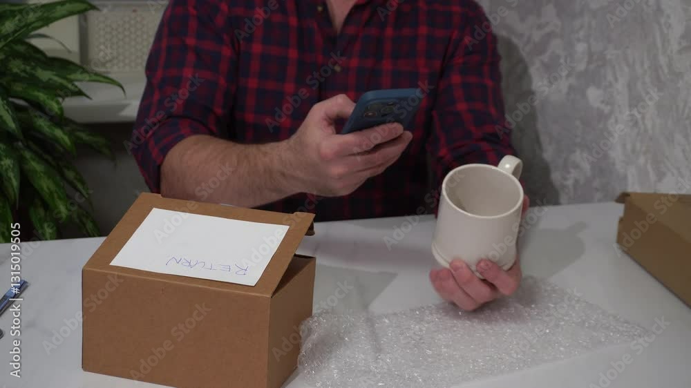 Wall mural man returning damaged mug using smartphone app