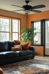 Serene Living Room Interior with Black Leather Sofa Decorative Pillows and Ceiling Fan Creating a Cozy Atmosphere