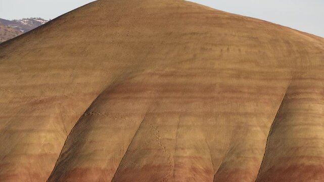 Colorful layers of sediment create a stunning view at John Day Fossil Beds National Monument in Painted Hills, Oregon