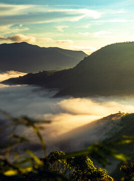 vintage style photo of a mountain with a sea of clouds during sunrise in tanay, philippines