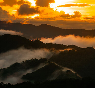 sunset landscape view of mountains with a sea of clouds in tanay, philippines