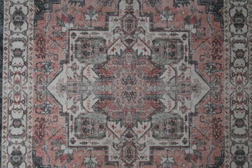 A rug with a pattern of red and gray