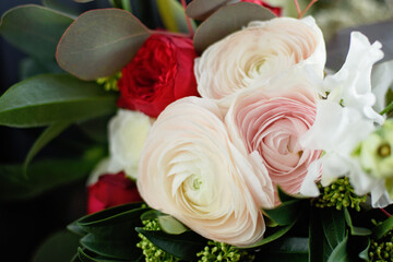 Beautiful holiday card. Mother Day greeting card. Delicate bouquet of white ranunculus and pastel tulips with soft green leaves, creating a romantic and elegant floral scene