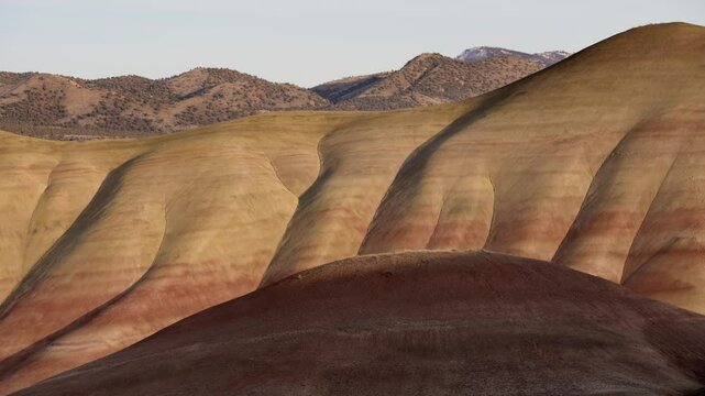 Colorful layers of sediment create a stunning view at John Day Fossil Beds National Monument in Painted Hills, Oregon