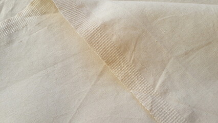Light vintage specialty fabric. Ticking. Cotton. Fabric texture. Textile light abstract background.