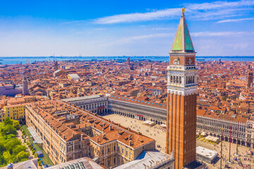 A breathtaking aerial view of San Marco Square in Venice, Italy, showcasing the iconic Campanile, historic architecture, and stunning canals, capturing the beauty of this world-famous landmark