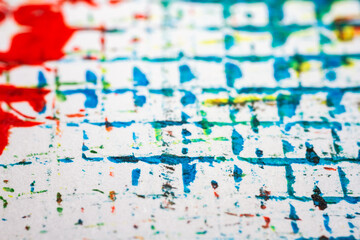 Extreme close up of colorful acrylic paint texture showing brush strokes. Selective focus.