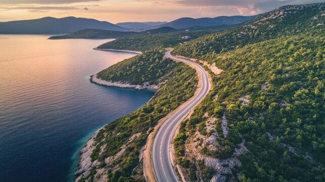 Aerial View of a Coastal Road Winding Through the Stunning Macchia Landscape of Dalmatia, Croatia