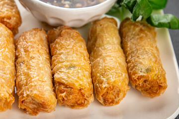 Nem rolls with sauce vietnamese rice paper roll delicious gourmet food background on the table rustic food top view copy space