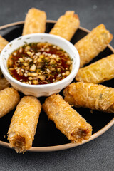 Nem rolls with sauce vietnamese rice paper roll delicious gourmet food background on the table rustic food top view copy space