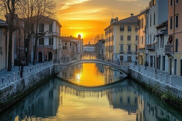 Naklejka premium Scenic Sunset Over the Canal at Prato della Valle, Padova, Italy - A Serene View of Bridges and Water Reflections in a Captivating Attraction