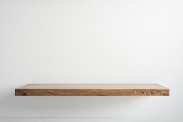 A simple floating wooden shelf mounted on a plain white wall creating a minimalist aesthetic design space