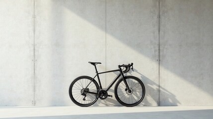 Sleek black bicycle resting against a minimalist concrete wall, bathed in sunlight, showcasing its elegant design and modern aesthetics