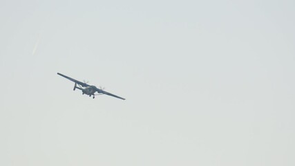 Military plane takes off during daytime at the airbase